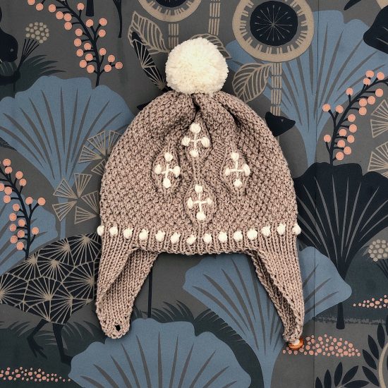 Knit bonnet BENNETT handknitted of virgin merino wool VAN BEREN