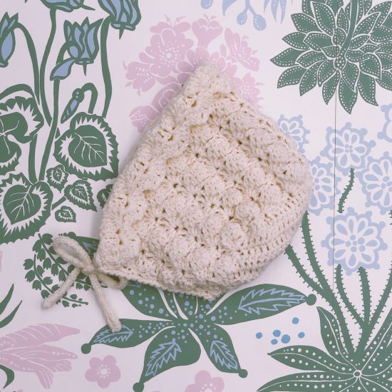 Knit bonnet CONNY handknitted of virgin merino wool VAN BEREN